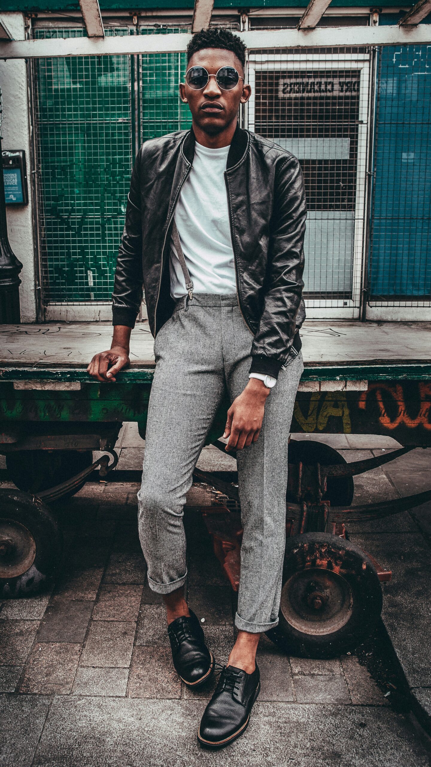 man in black jacket posing